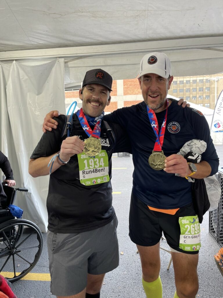 Bill B. & Jamen S. celebrate their marathon finish on October 17, 2021.